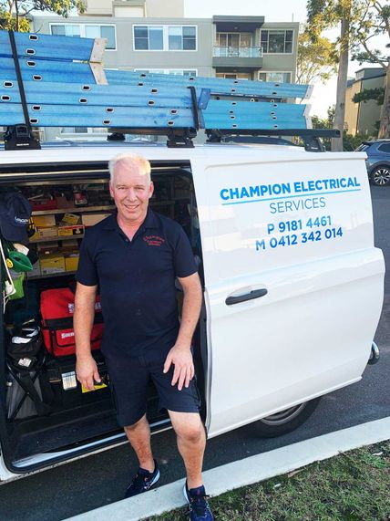 Romeo of Champion Electrical Services in front of the fully equipped company van